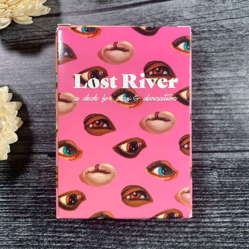 lost river deck is pink with different colored eyes on the cover. 